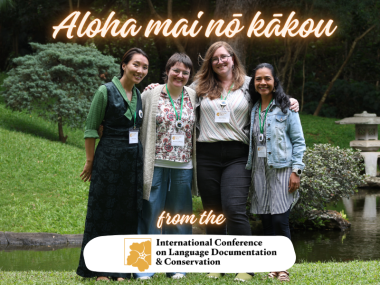 Four women standing in a garden, with text "Aloha mai nō kākou from the International Conference on Language Documentation & Conservation"
