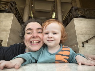 Pippa smiling with her son