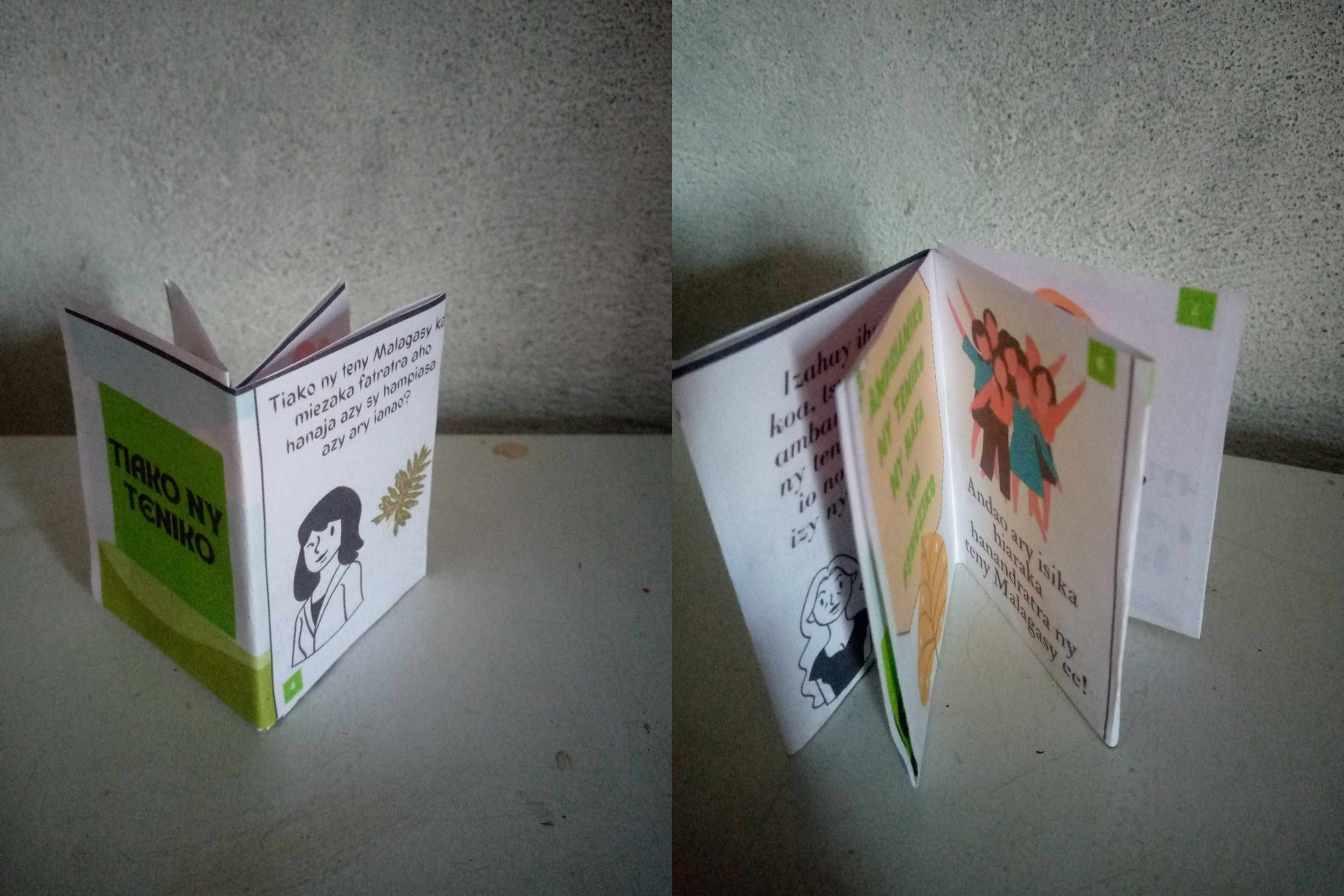 Photo of the zine printed and folded on a table