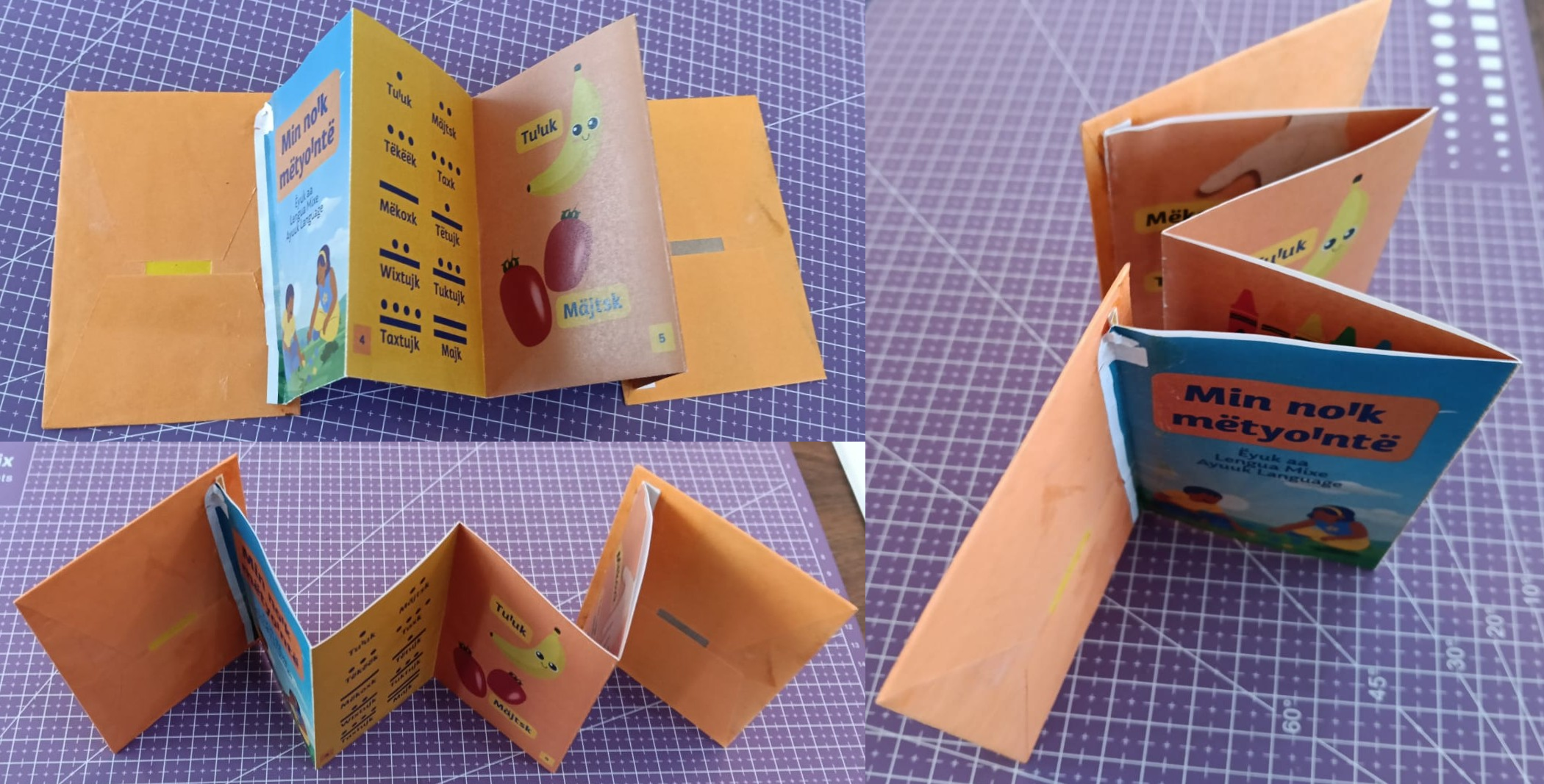 Zine printed and folded on a purple cutting mat.