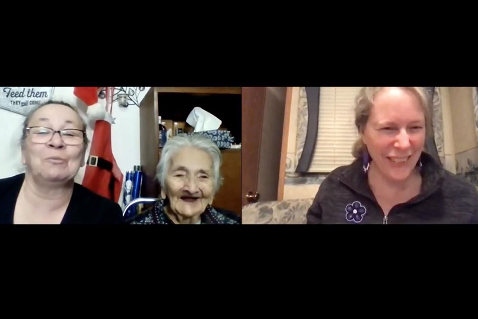 A Zoom screenshot of three women, all laughing.